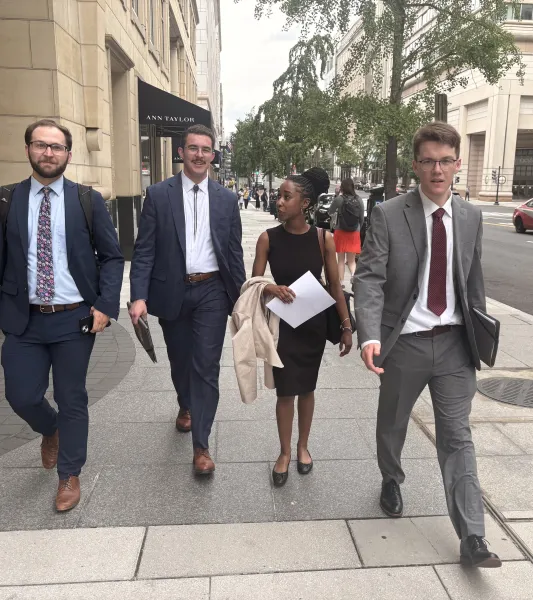 "IDEA fellowship coordinator Adam Duffy and Summer Democracy Fellows Maxwell Kiernan, Elise Britton and Ryan Mahoney walking to their next meeting in DC June 22."